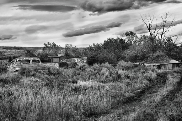 Abandoned homestead and cars